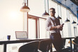 © Vasyl - Young man is working in modern office
