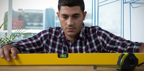 Poster - Composite image of close-up of serious construction worker