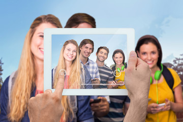 Poster - Hand holding tablet pc against park on sunny day