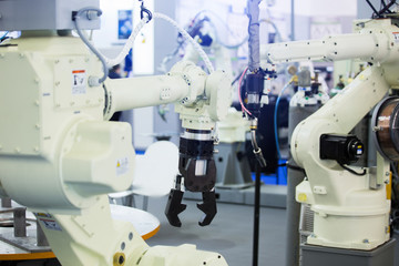 Aufkleber - A robotic arm. Automatic robot in a smart factory. Assembly line