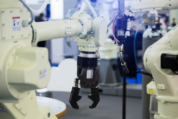 Aufkleber - A robotic arm. Automatic robot in a smart factory. Assembly line