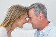 © WavebreakmediaMicro - Side view of a happy couple looking at each other