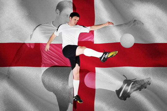 Football player in white kicking against digitally generated english national flag