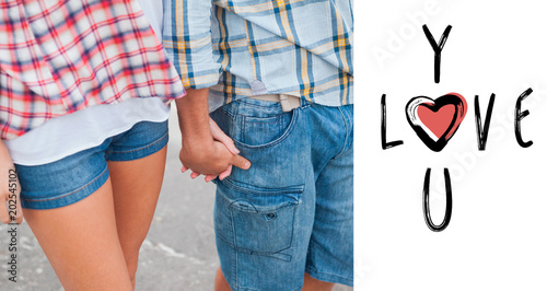Couple In Check Shirts And Denim Holding Hands Against Cute