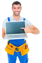 Poster - Happy repairman pointing at laptop