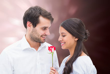 Handsome Man Offering His Girlfriend A Rose Against Valentines Heart Design