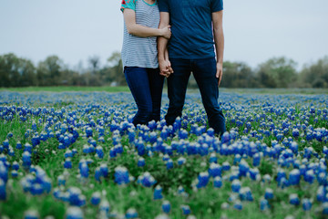 Couple in love in field of Texas Bluebonnets