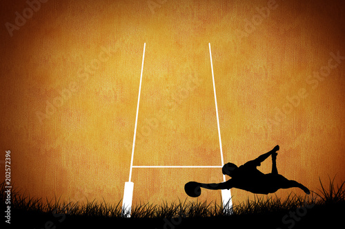 Dekoracja na wymiar  sylwetka-gracza-rugby-na-pomaranczowym-tle