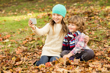 Wall Mural - Happy siblings in the park