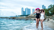 Couple friends, Asian women happy on the beach during at summer vacations; summer holidays, travel, people and vacation concept.