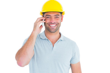 Poster - Smiling handyman talking on mobile phone