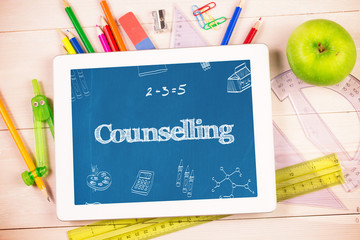 Leinwandbilder - The word counselling and school doodles against students desk with tablet pc