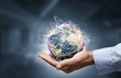 Businessman holding globe,Internet Concept of global business.Elements of this image furnished by NASA