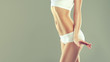 Perfect slim toned young body of the girl . An example of sports , fitness or plastic surgery and aesthetic cosmetology. 
