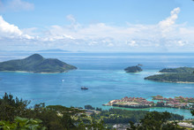 Beautiful View Of The Seychelles, The Indian Ocean And The Blue Clear Sky With Easy Clouds
