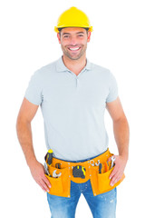 Poster - Portrait of smiling handyman wearing tool belt