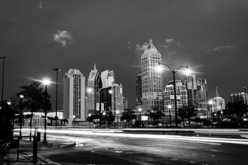 Sticker - Illuminated Midtown in Atlanta, USA at night. Car traffic, illuminated buildings and dark sky. Black and white