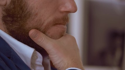 Poster - close up unrecognizable man touching his red beard. details redhead male