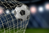 Fototapeta Sport - Soccerball in net