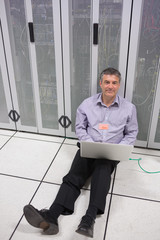 Aufkleber - Technician checking the servers on the floor 