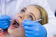 © WavebreakmediaMicro - Dentist examining a female patient with tools