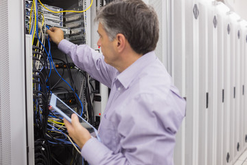 Aufkleber - Man doing server maintenance with tablet