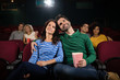 © WavebreakmediaMicro - Couple watching movie in theatre