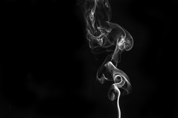 abstract fragment movement of white smoke on black background.