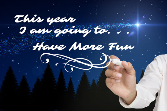 Businessman about to write something against shooting star over forest at night