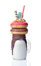 Crazy Milk Shake With Pink And Chocolate Donuts, Color Candy And Straw In Glass Jar