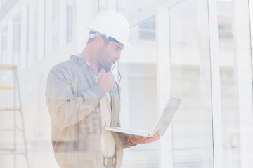 Poster - Architect looking at laptop in office