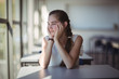© WavebreakmediaMicro - Thoughtful schoolgirl sitting in classroom