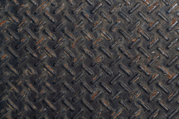 Rusty black diamond plate texture and background