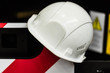 © Yakov - Safety helmet against industrial background