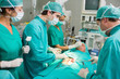 © WavebreakmediaMicro - Surgeons operating a patient belly