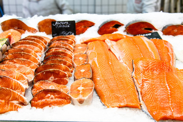 Wall Mural - salmon pieces lie on the counter in the market.