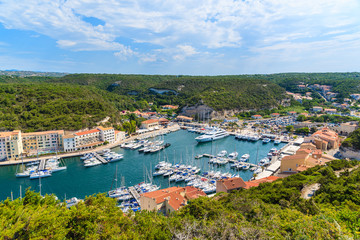 Wall Mural - View of Bonifacio port with sailing boats and luxury yachts, Corsica island, France