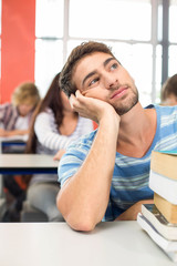 Poster - Thoughtful student with books in classroom