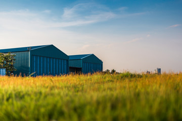 modern new company warehouse building, farm buildings by the field, outdoors theme concept vintage r