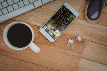 Poster - White smartphone with cup of coffee against champagne pouring on flute