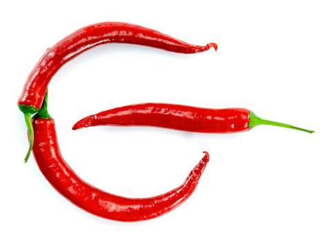 red chili peppers arranged as on off power sign on white background abstract concept photo 