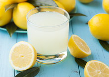 Glass Of Organic Fresh Lemon Juice And Fruits