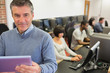© WavebreakmediaMicro - Teacher holding a tablet PC