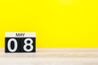 May 8th. Day 8 of may month, calendar on yellow background. Spring time, empty space for text
