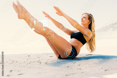 Fit blonde in core balance pilates pose on the beach against fitness interface Poster