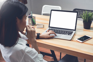 Fototapete - woman using laptop on table in office room, for graphics display montage. Take your screen to put on advertising.