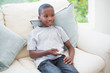 © WavebreakmediaMicro - Little boy watching tv on the couch
