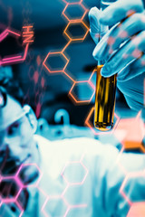Poster - Portrait of a male scientist looking at a test tube against science and medical graphic