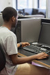 © WavebreakmediaMicro - Man sitting at a computer