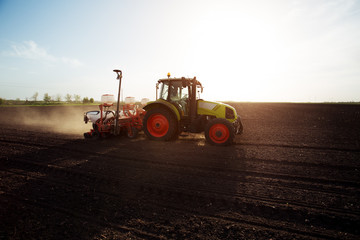 Farmer seeding crops at field